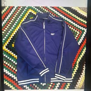 Navy blue vintage 90’s rebook track jacket with white stripes